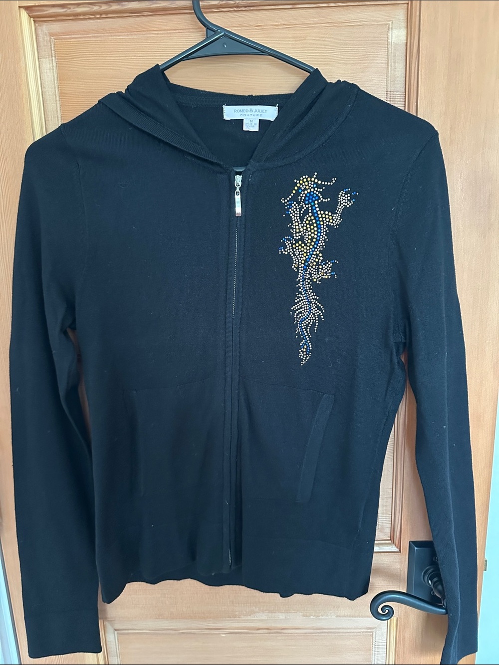 Romeo & Juliet Couture Black Zip Hoodie with Gold and Blue Stud Detail